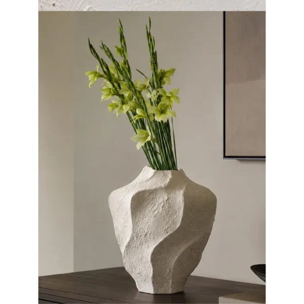 Designer Wabi-Sabi Folded Texture Ceramic Vase, Short in ivory — in a room setting