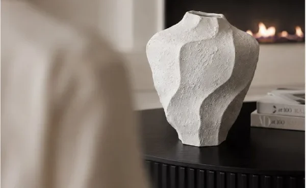 Designer Wabi-Sabi Folded Texture Ceramic Vase, Short in ivory — in a room setting