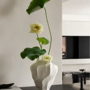 Designer Wabi-Sabi Folded Texture Ceramic Vase, Short in ivory — in a room setting
