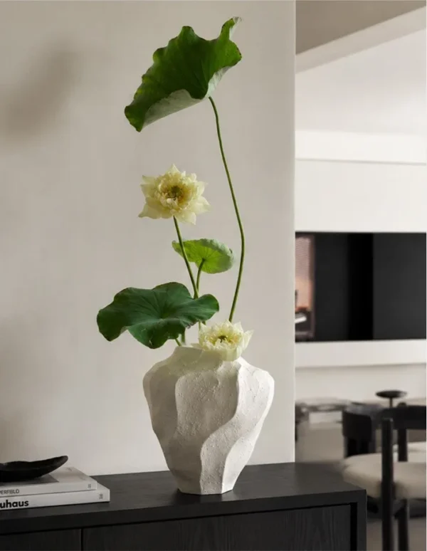 Designer Wabi-Sabi Folded Texture Ceramic Vase, Short in ivory — in a room setting