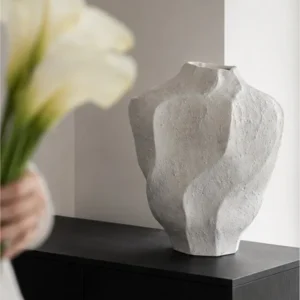 Designer Wabi-Sabi Folded Texture Ceramic Vase, Short in ivory — in a room setting