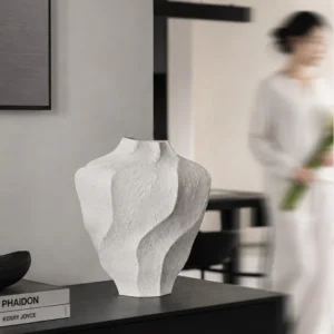 Designer Wabi-Sabi Folded Texture Ceramic Vase, Short in ivory — in a room setting