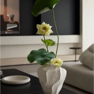 Designer Wabi-Sabi Folded Texture Ceramic Vase, Short in ivory — in a room setting