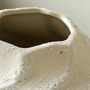 Designer Wabi-Sabi Folded Texture Ceramic Vase, Short in ivory — in a room setting