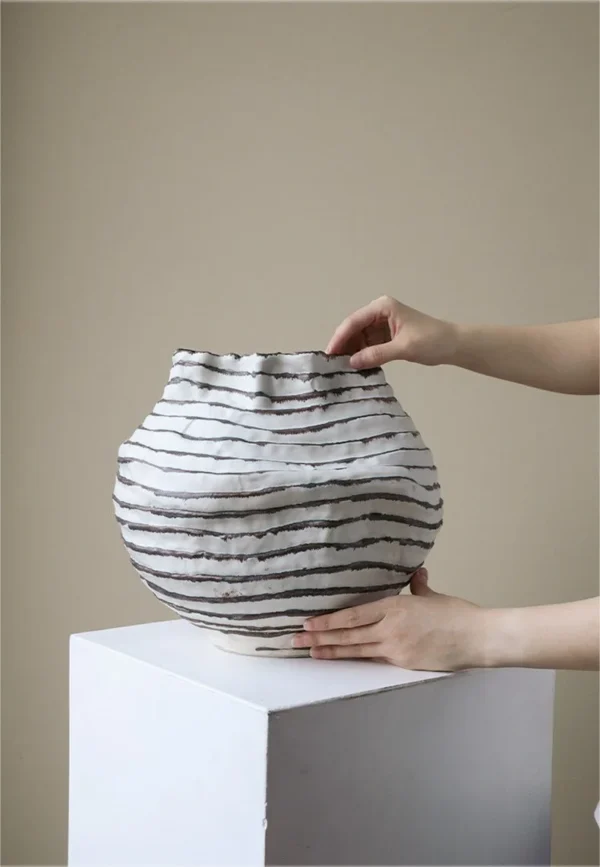 Jingdezhen Black Line Pleated Art Vases, Three Forms in ivory — in a room setting