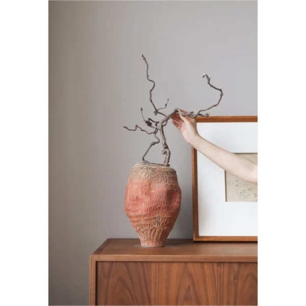 Jingdezhen Red Clay Textured Jar Vase, Medium in rust — in a room setting