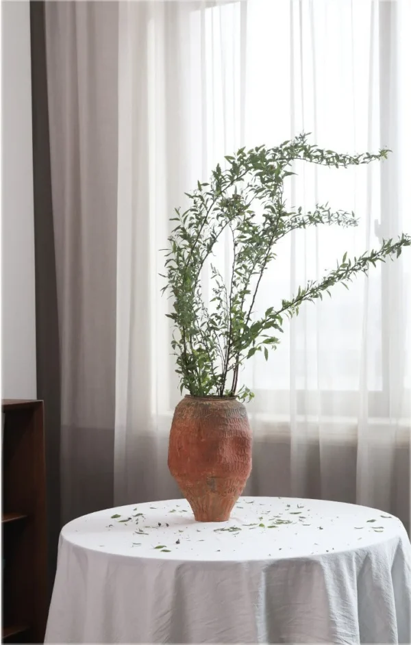 Jingdezhen Red Clay Textured Jar Vase, Medium in rust — in a room setting