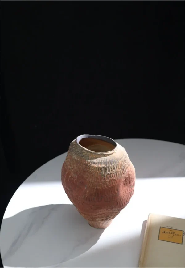 Jingdezhen Red Clay Textured Jar Vase, Medium in rust — in a room setting