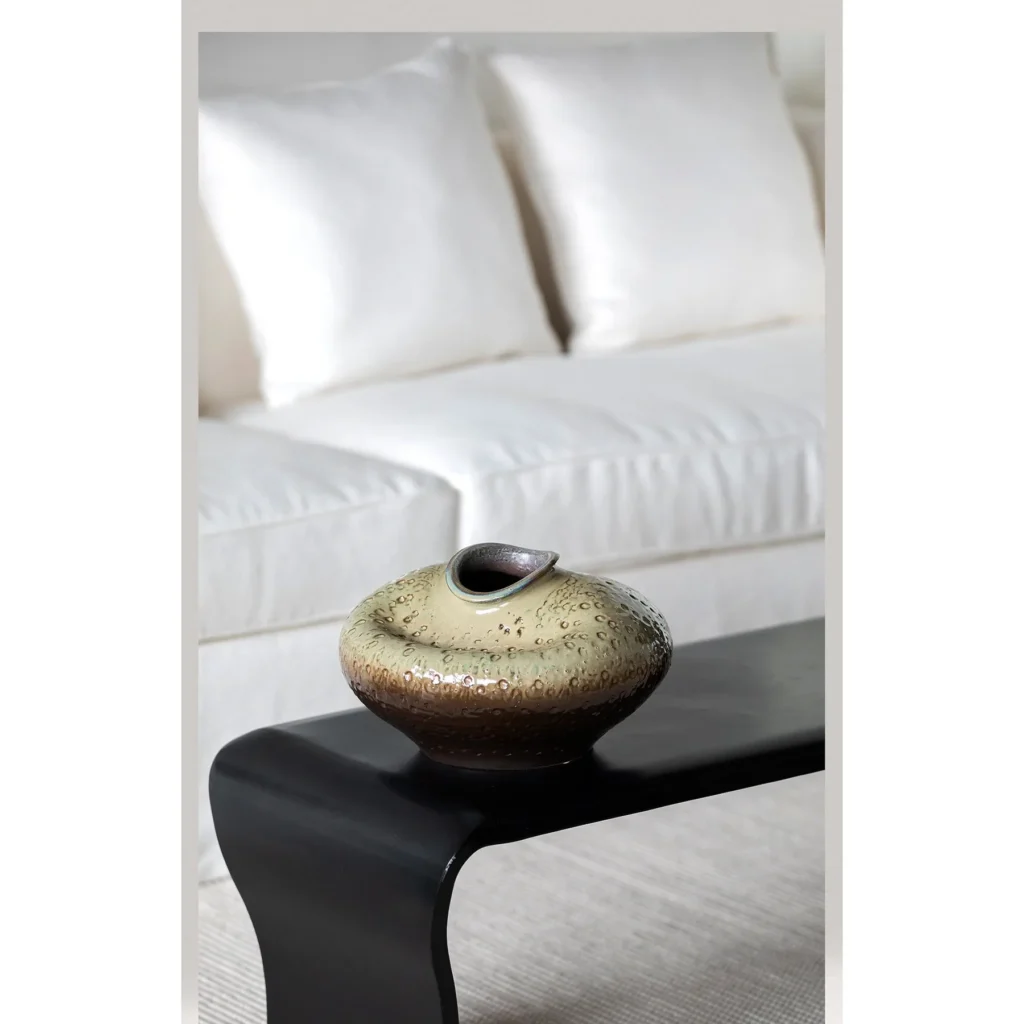 Wabi-Sabi Kiln-Change Flat-Belly Ceramic Vase, Green, Red in olive — in a room setting