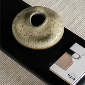 Wabi-Sabi Kiln-Change Flat-Belly Ceramic Vase, Green, Red in olive — in a room setting