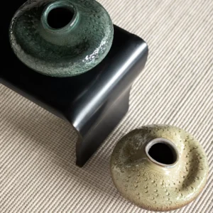 Wabi-Sabi Kiln-Change Flat-Belly Ceramic Vase, Green, Red in olive — in a room setting