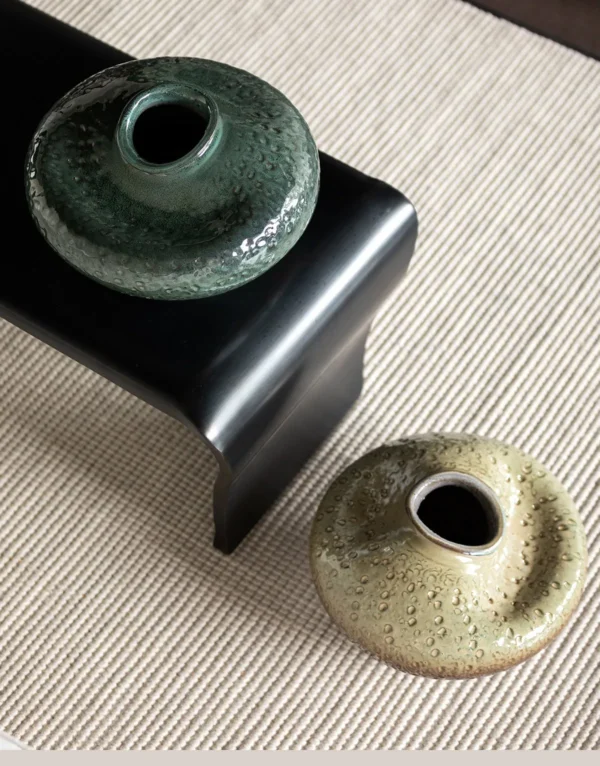 Wabi-Sabi Kiln-Change Flat-Belly Ceramic Vase, Green, Red in olive — in a room setting