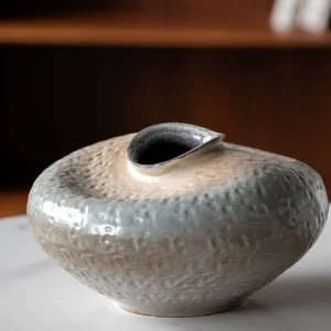 Wabi-Sabi Kiln-Change Flat-Belly Ceramic Vase, Green, Red in olive — in a room setting