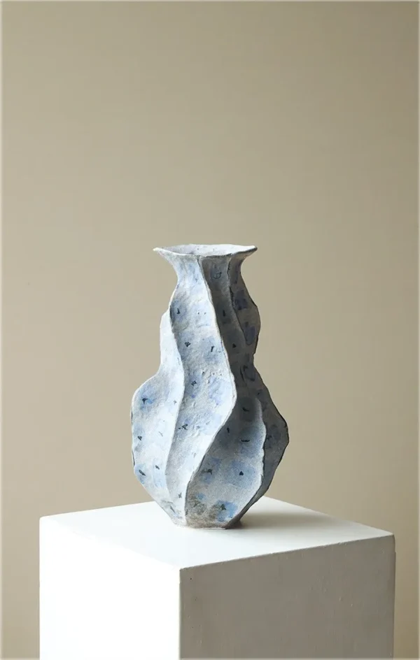 Jingdezhen Blue Geometric Faceted Stoneware Vase, Medium in blue — in a room setting