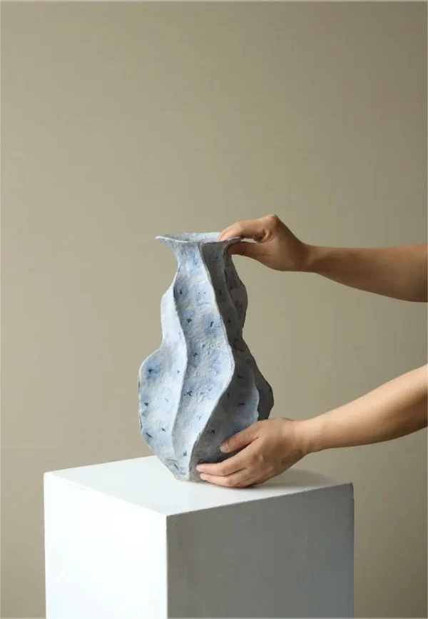 Jingdezhen Blue Geometric Faceted Stoneware Vase, Medium in blue — in a room setting