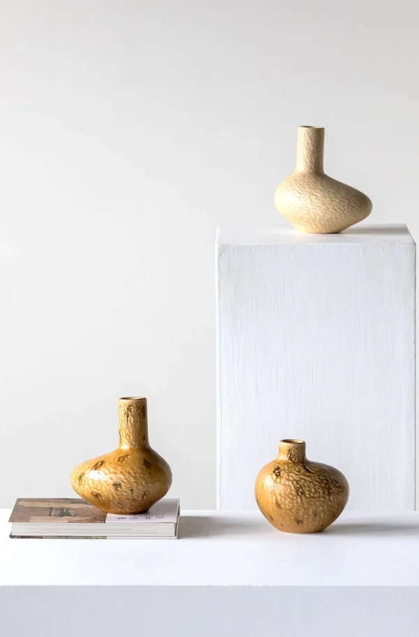 Wabi-Sabi Ochre Speckled Flat-Belly Ceramic Vase in mustard — in a room setting
