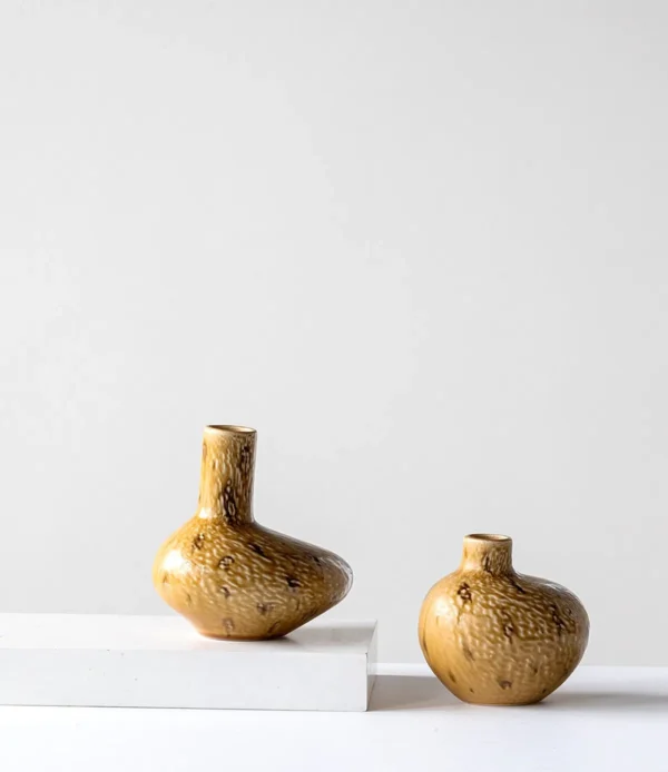 Wabi-Sabi Ochre Speckled Flat-Belly Ceramic Vase in mustard — in a room setting