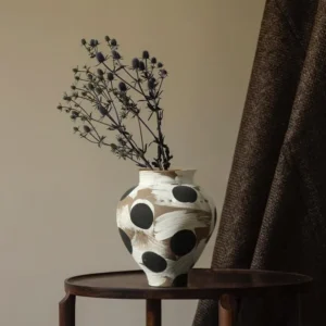 Wabi-Sabi Black Polka Dot Narrow-Mouth Ceramic Vase, Small in oatmeal — in a room setting