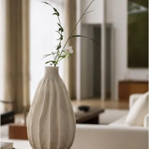 Wabi-Sabi Ribbed White Ceramic Vase, Two Forms in ivory — in a room setting