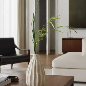 Wabi-Sabi Ribbed White Ceramic Vase, Two Forms in ivory — in a room setting