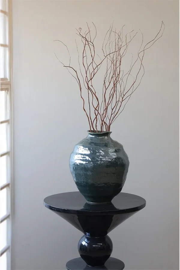 Wabi-Sabi Dark Green Glazed Round-Belly Jar, Large or Small in olive — in a room setting