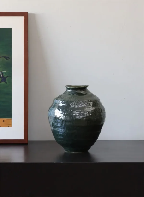 Wabi-Sabi Dark Green Glazed Round-Belly Jar, Large or Small in olive — in a room setting