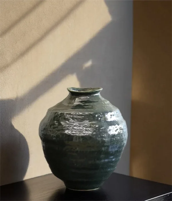 Wabi-Sabi Dark Green Glazed Round-Belly Jar, Large or Small in olive — in a room setting
