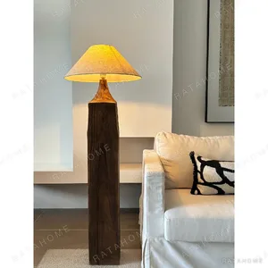 Wabi-Sabi Aged Wood Post Floor Lamp with Linen Shade in clay — in a room setting