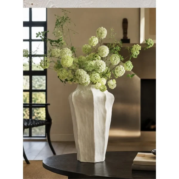 Designer Wabi-Sabi Faceted Cream Ceramic Vase, Large in oatmeal — in a room setting