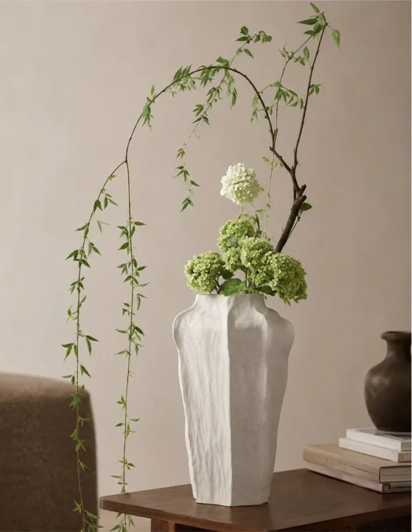 Designer Wabi-Sabi Faceted Cream Ceramic Vase, Large in oatmeal — in a room setting