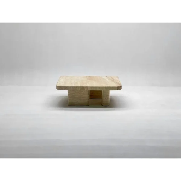 Wabi-Sabi Travertine Square Coffee Table on Column Base in sand — in a room setting