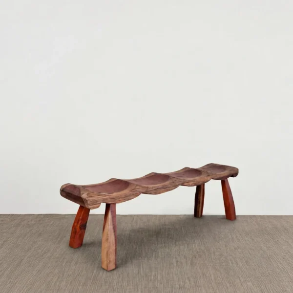 Wabi Seat Carved Wood Bench in Red-Brown — in a room setting