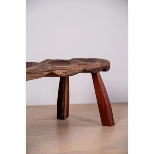 Wabi Seat Carved Wood Bench in Red-Brown — in a room setting