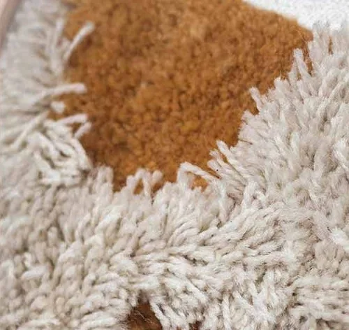 Tufted Textile Art Set of 2 in rust — detail