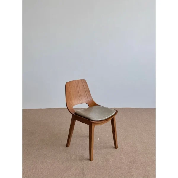 Walnut Sculpted Armchair in walnut — in a room setting