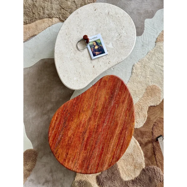 Curved Travertine Coffee Table on Dark Walnut Cylinder Base in oatmeal — in a room setting