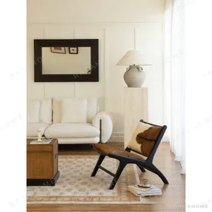 Goat Hide Teak Lounge Chair in Brown and White — in a room setting