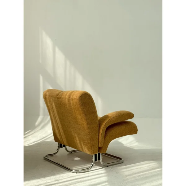Warm Orange Bouclé Cantilever Lounge Chair on Chrome Frame in rust — in a room setting