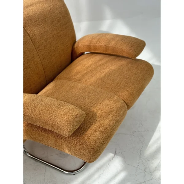 Warm Orange Bouclé Cantilever Lounge Chair on Chrome Frame in rust — in a room setting
