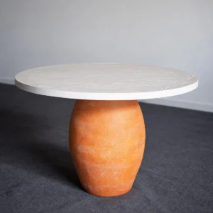 Terracotta Urn-Base Round Dining Table in rust — front view