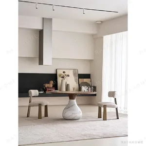 Water Drop Round Table with Wood Top and Marble Base in walnut — in a room setting