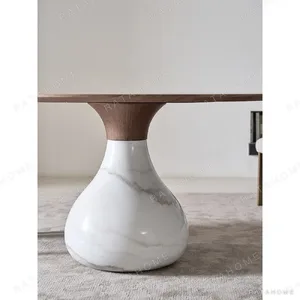 Water Drop Round Table with Wood Top and Marble Base in walnut — in a room setting