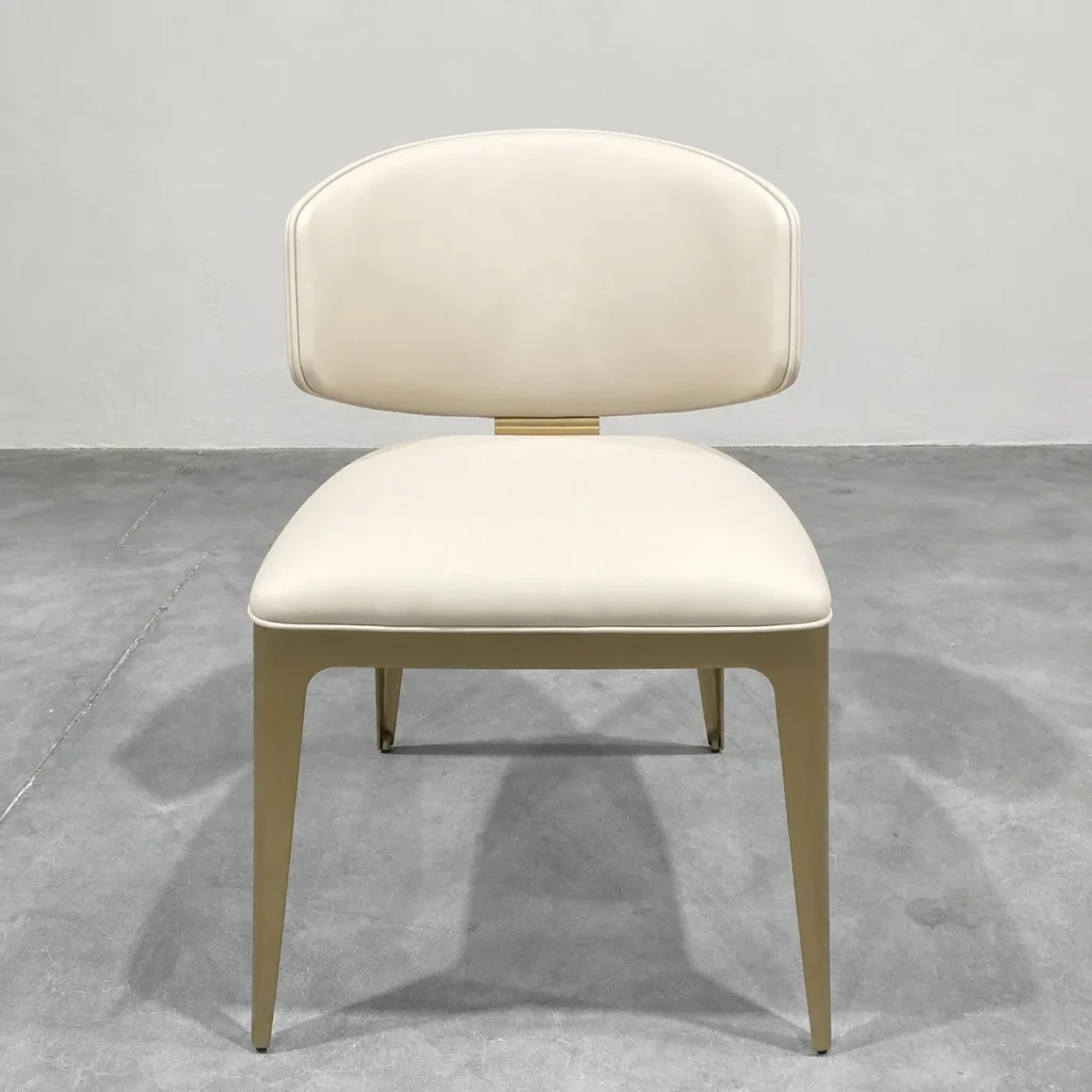 Wave-Back Dining Chair in Cream Leather on Champagne Steel — front view