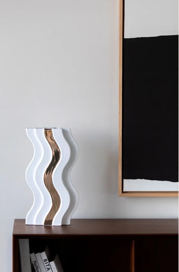 Wave-Form White Ceramic Vase with Gold Band in ivory — in a room setting