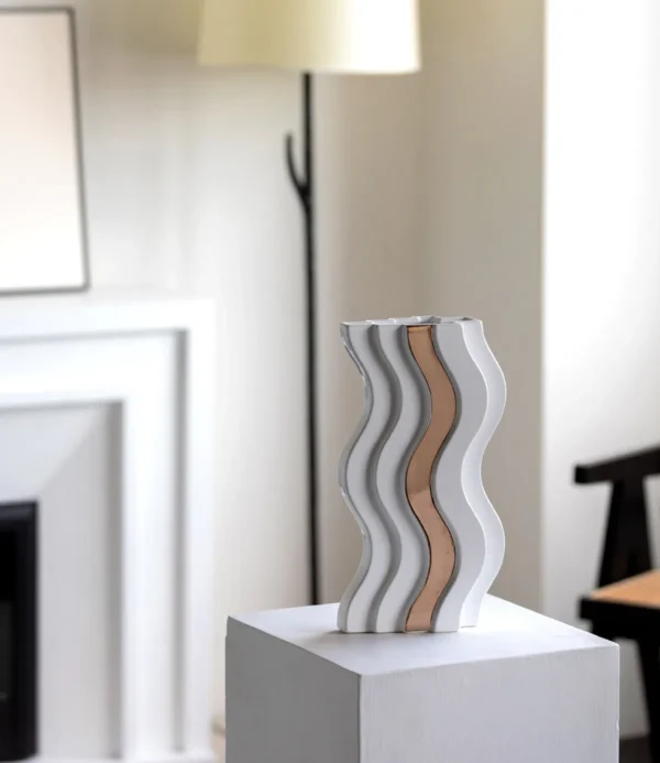 Wave-Form White Ceramic Vase with Gold Band in ivory — in a room setting