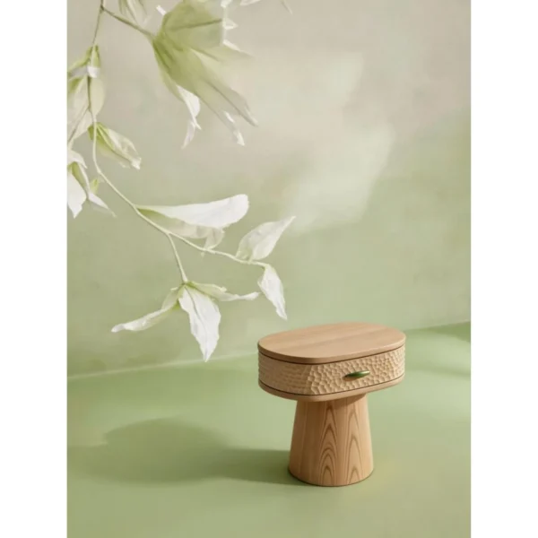 Wenyu Hammered-Front Round Nightstand in natural oak — in a room setting