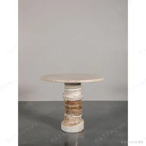 Cream Stone Round Side Table on Layered Onyx Column Base in oatmeal — in a room setting