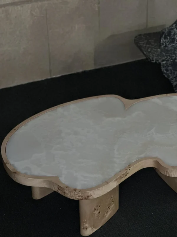 White Jade Marble Cloud Coffee Table on Burl Wood Base in ivory — in a room setting