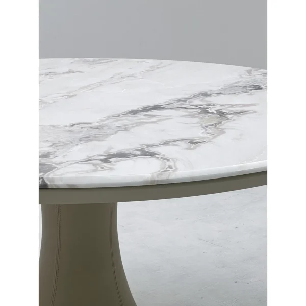 White Stone Round Table on Leather-Wrapped Trumpet Base in ivory — in a room setting