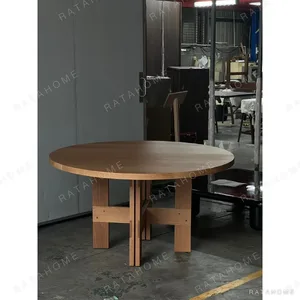 White Oak Round Dining Table on Cross Base in natural oak — in a room setting